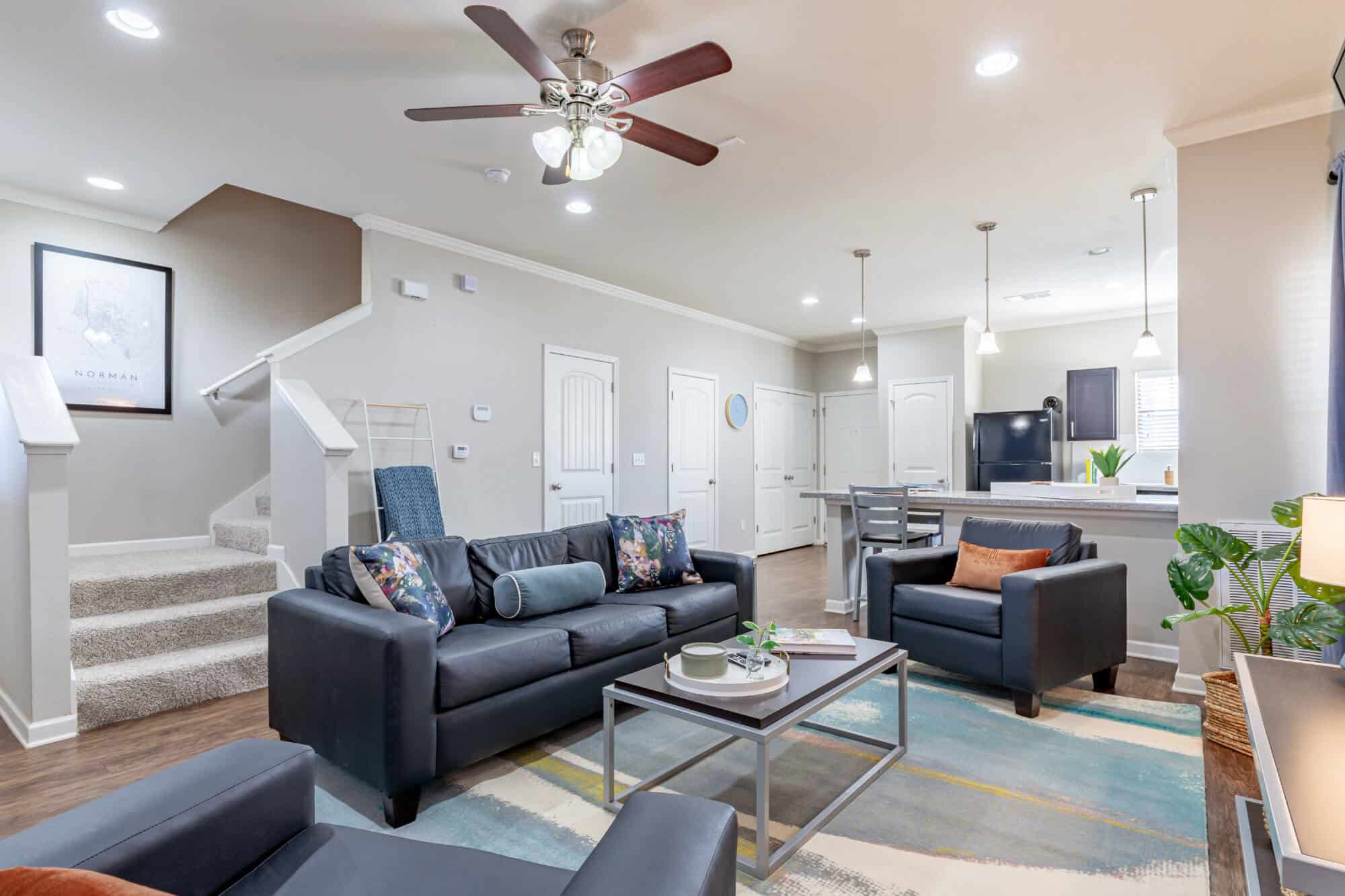 the collective at norman off campus cottage apartments furnished and unfurnished options 2 story floor plans living room with smart tv