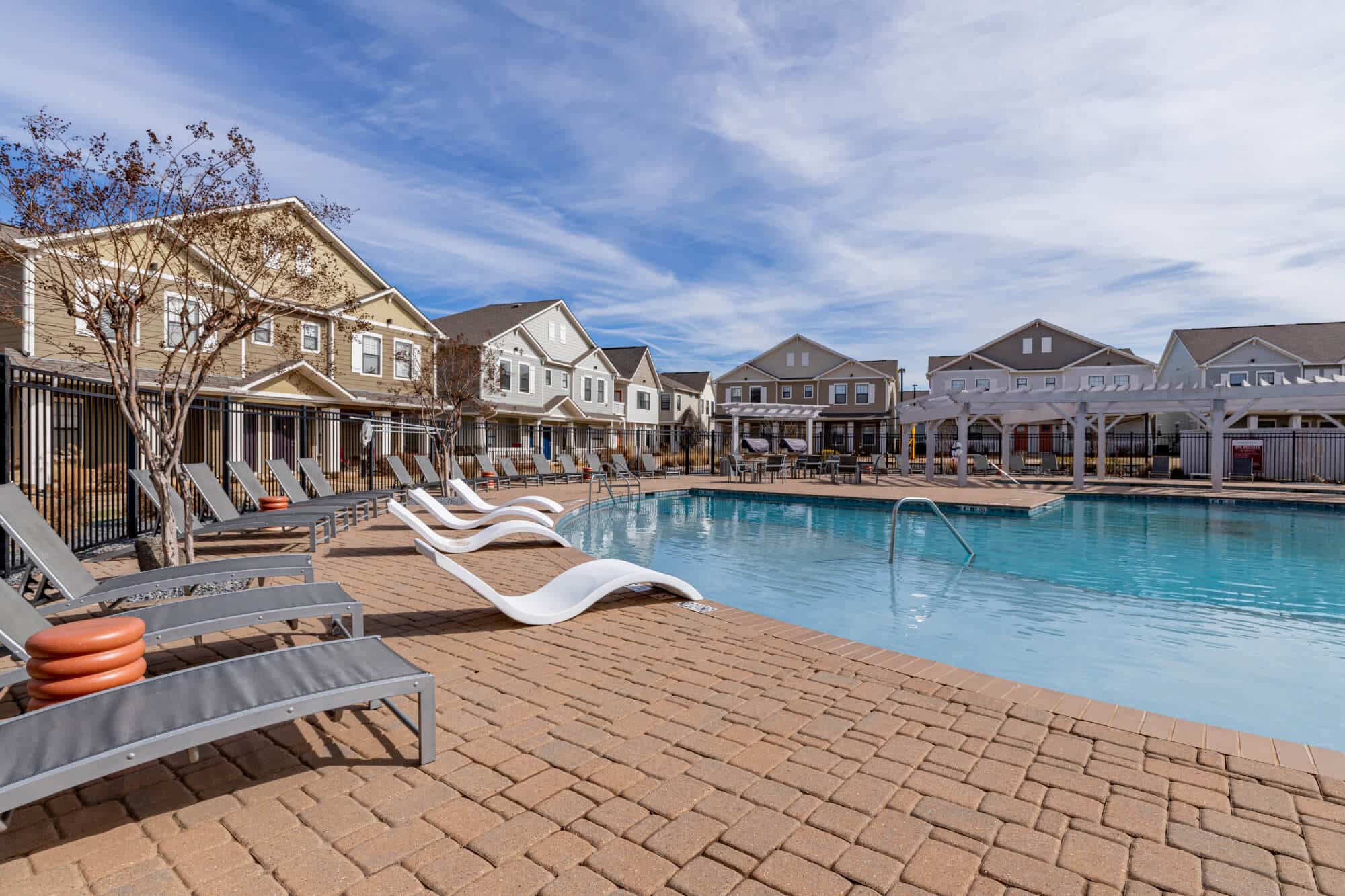 the collective at norman off campus cottage apartments near the university of oklahoma resort style pool sundeck lounge seating