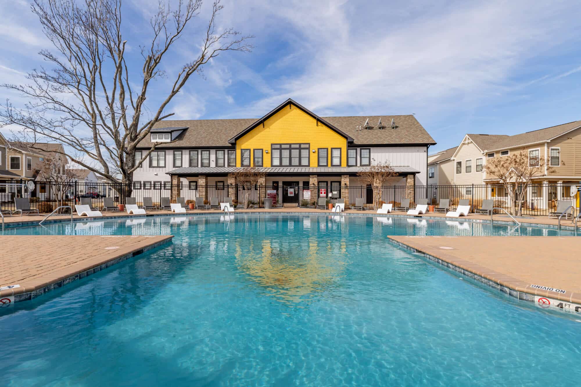 the collective at norman off campus cottage apartments near the university of oklahoma resort style pool and clubhouse exterior